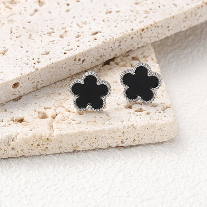 Boucles d'oreilles argentées à fleurs noires multiples