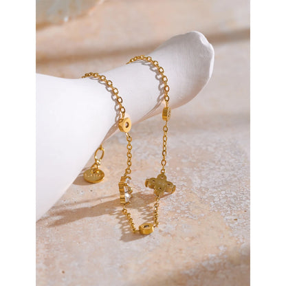 Bracelet à deux fleurs dorées avec cristaux