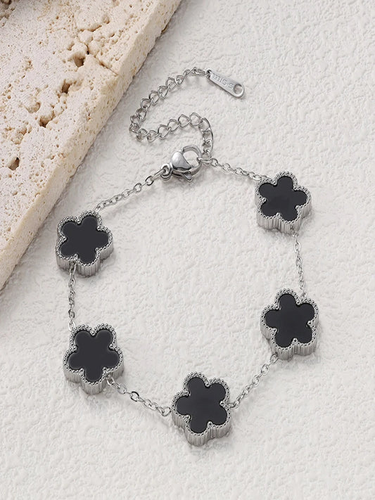 Bracelet argenté à fleurs noires multiples