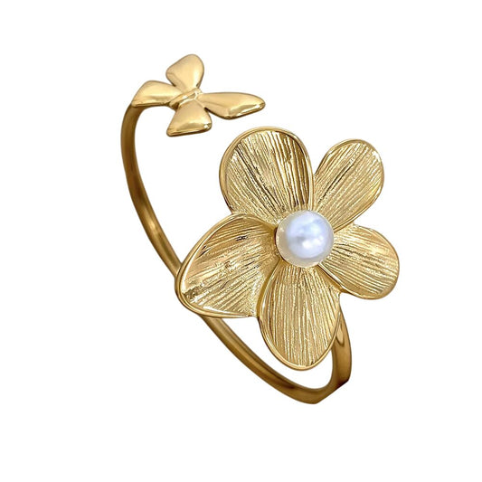Bracelet doré ajustable à fleur perlée et papillon