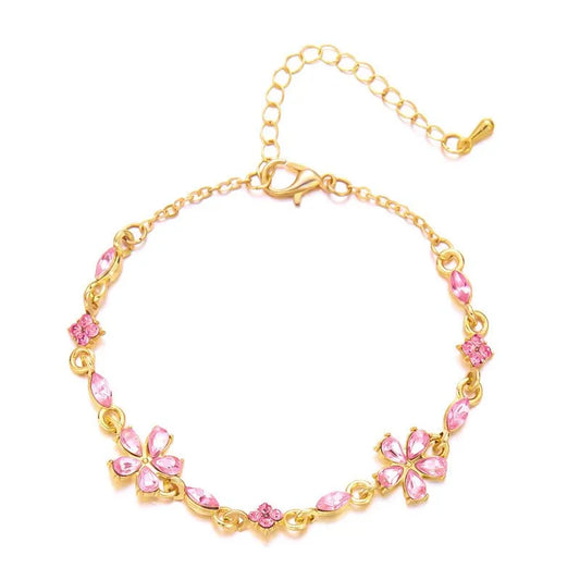 Bracelet doré avec cristaux et fleurs roses