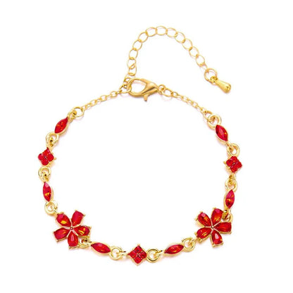 Bracelet doré avec cristaux et fleurs rouges
