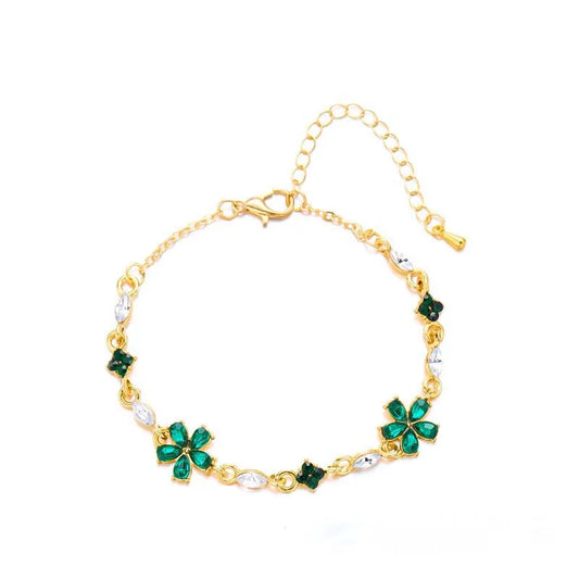 Bracelet doré avec cristaux et fleurs vertes